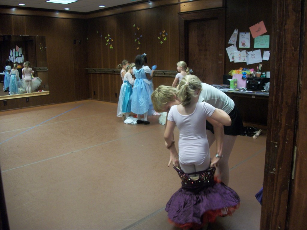 That's Clara in the back on the left, in her Elsa costume.  She and Cinderella are helping the other little girls pick out their costumes.