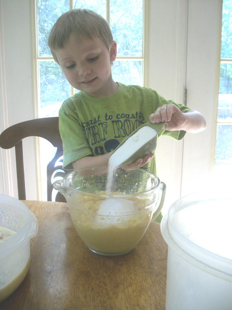 Jeff does love it when Mason & I cook lunch for him to have when he gets home from work.  Here Mason is busy fixing corn pudding.